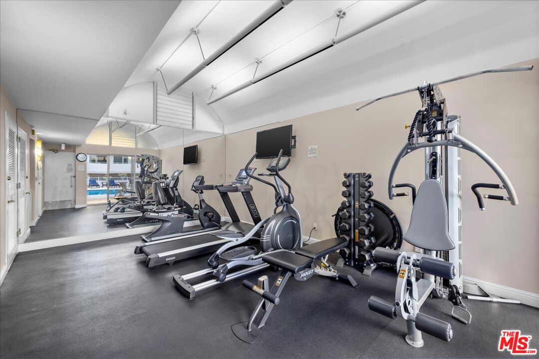 1333 South Beverly Glen Boulevard, Unit 904 Los Angeles, CA 90024 - Photo 29 of 32 a view of a room with gym equipment