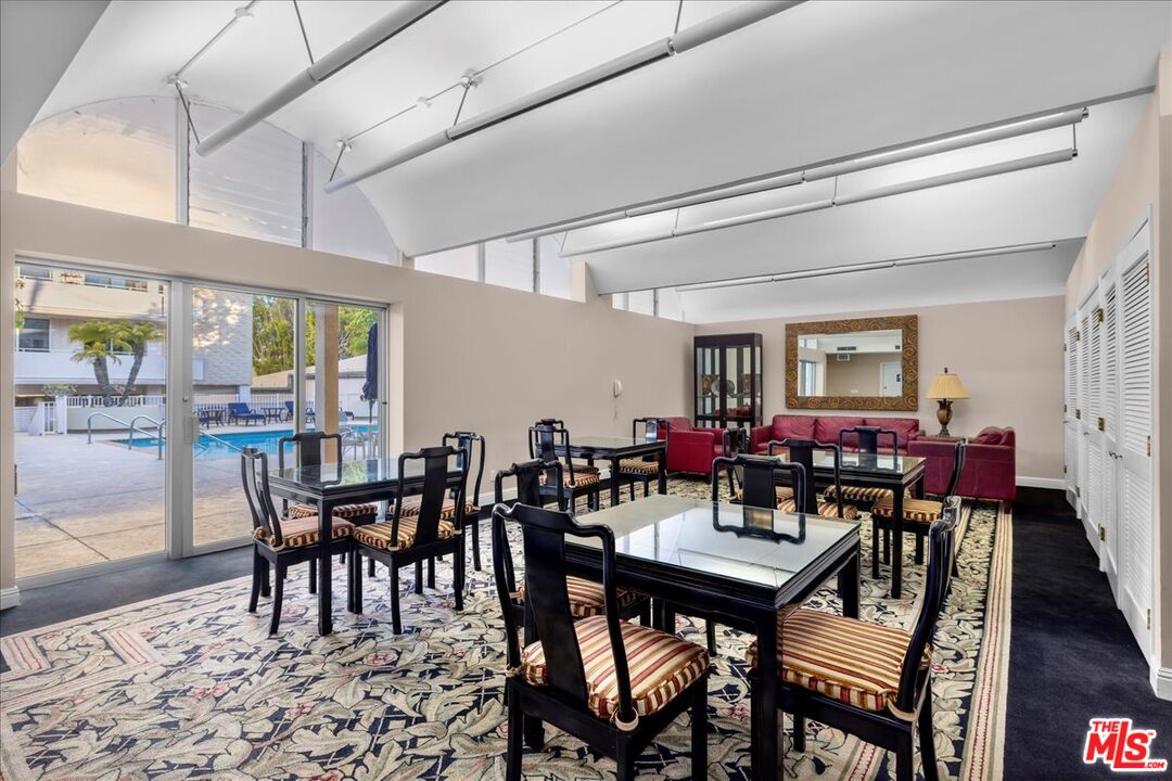 1333 South Beverly Glen Boulevard, Unit 904 Los Angeles, CA 90024 - Photo 30 of 32 a view of a dining room with furniture window and wooden floor
