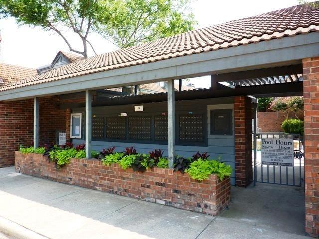 18240 Midway Road, Unit 1204 Dallas, TX 75287 - Photo 7 of 27 a front view of a building with potted plants