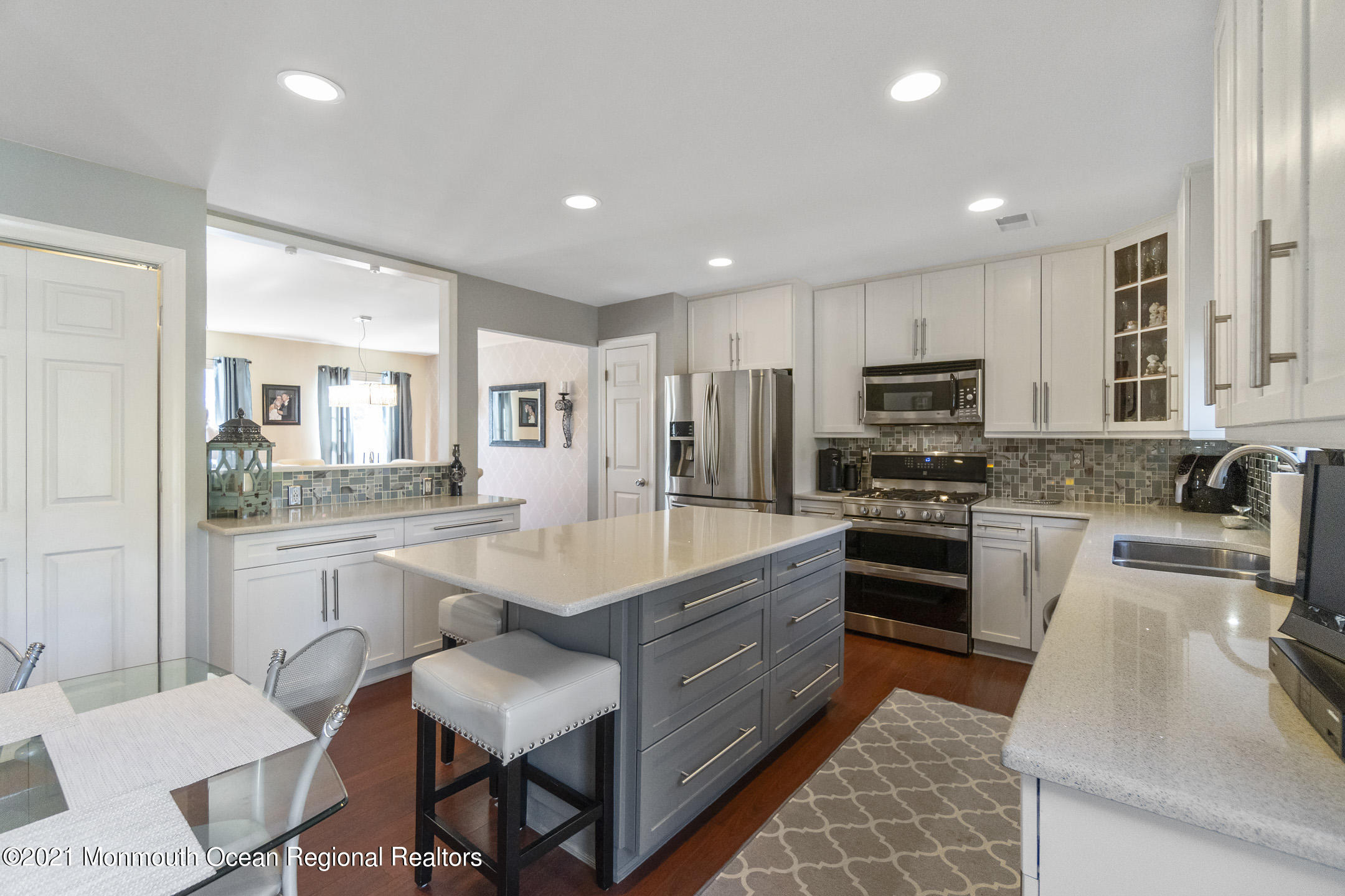 9 Rutgers Drive Howell, NJ 07731 - Photo 11 of 45 a large kitchen with kitchen island white cabinets and stainless steel appliances