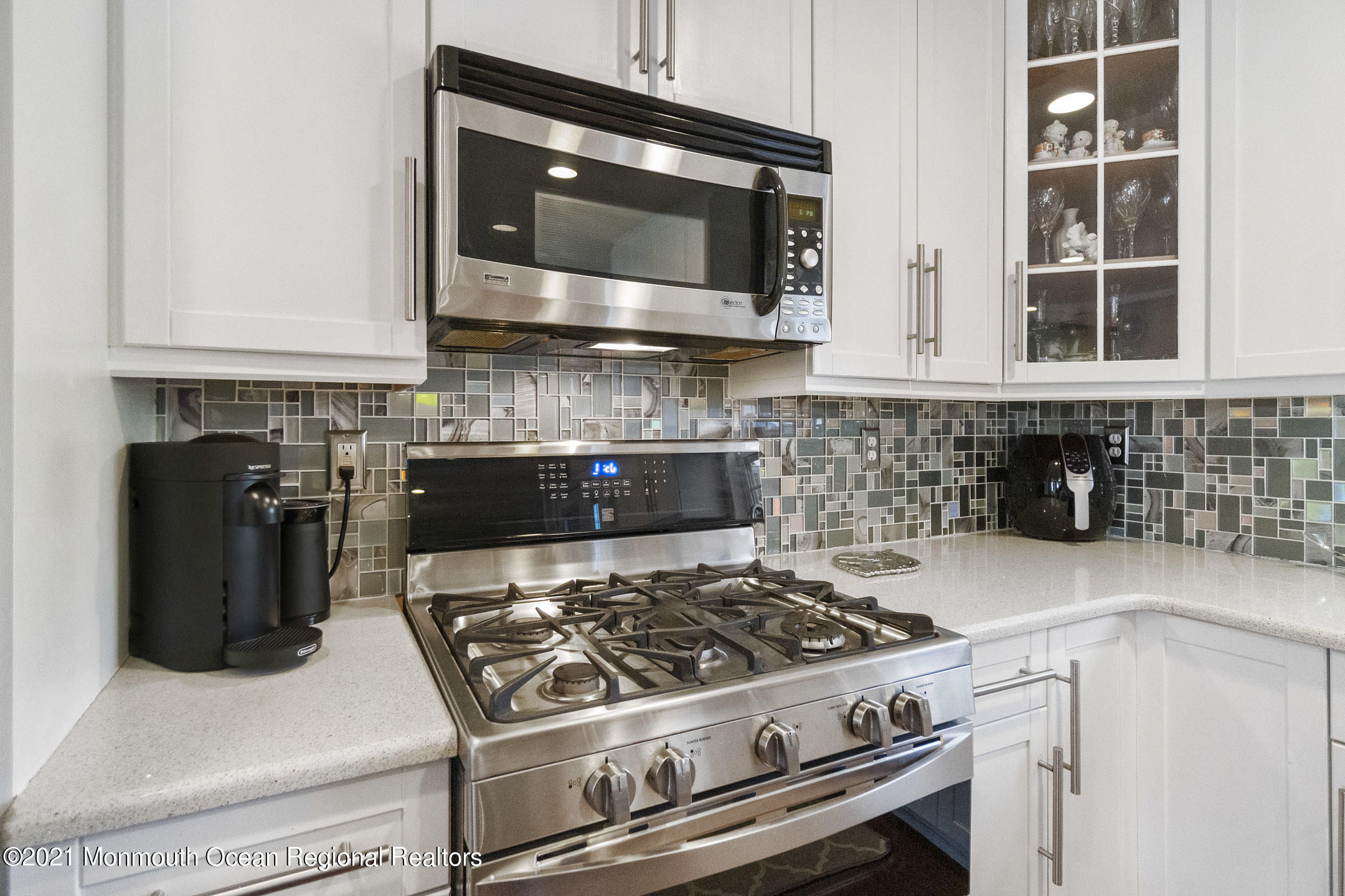 9 Rutgers Drive Howell, NJ 07731 - Photo 12 of 45 a kitchen with granite countertop a stove and a microwave