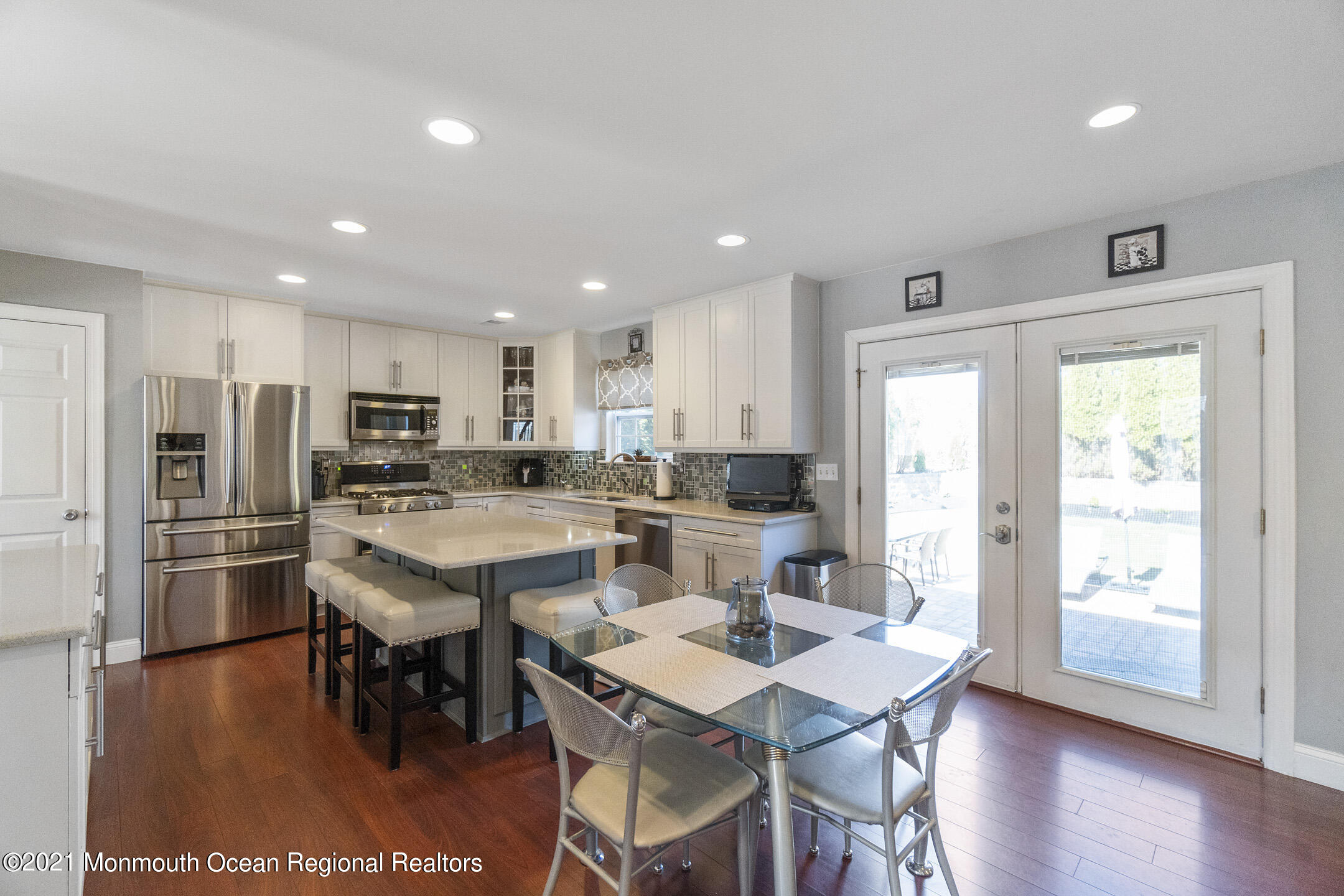 9 Rutgers Drive Howell, NJ 07731 - Photo 13 of 45 a large kitchen with a table and chairs