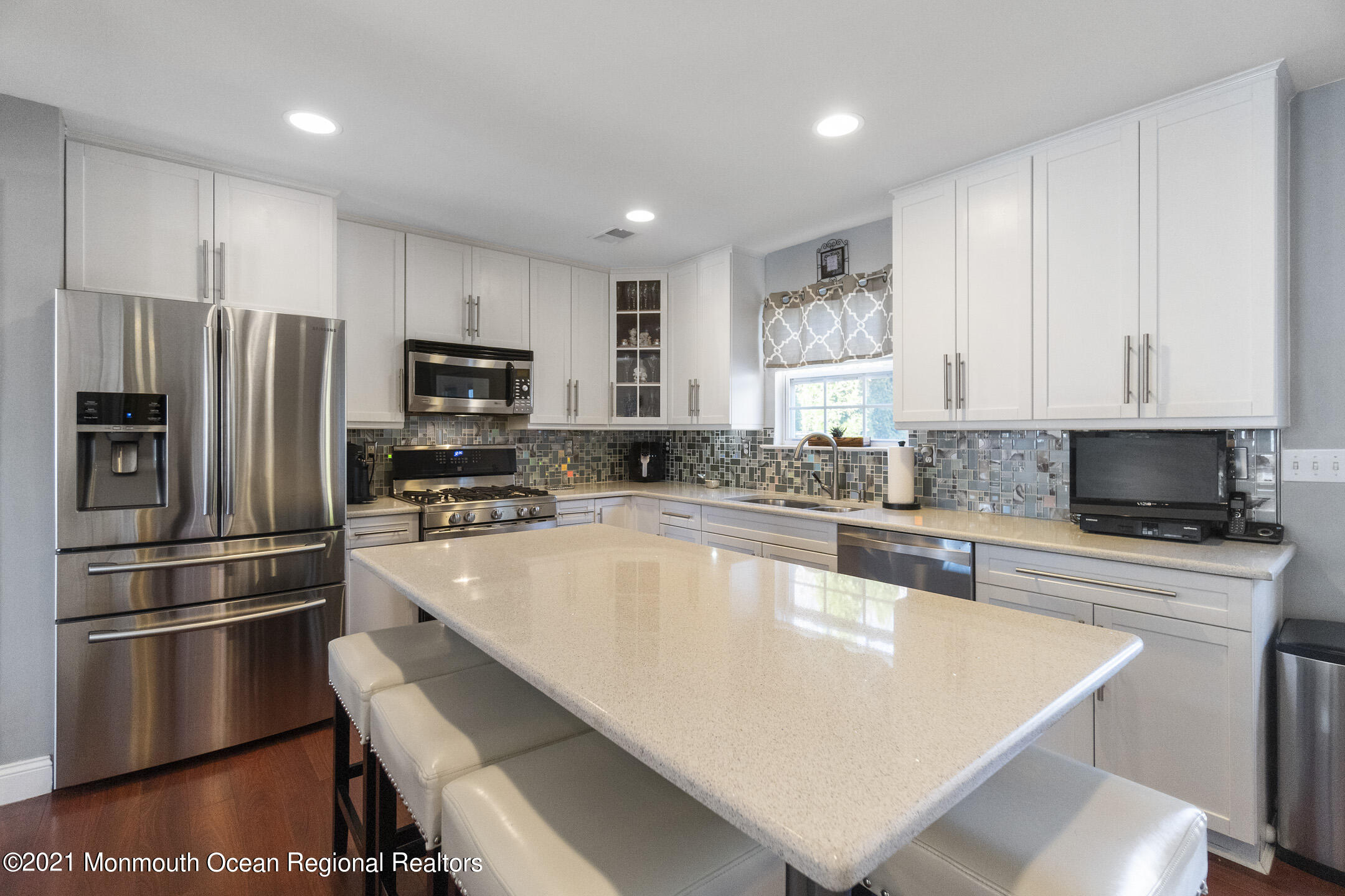 9 Rutgers Drive Howell, NJ 07731 - Photo 14 of 45 a large kitchen with stainless steel appliances a refrigerator a stove a sink cabinets and a counter space