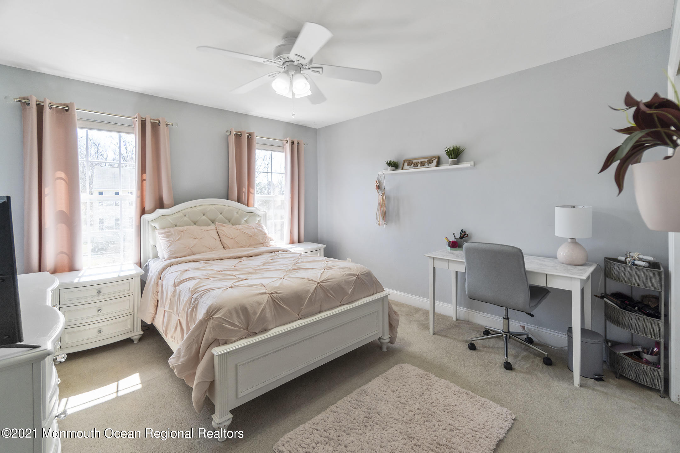 9 Rutgers Drive Howell, NJ 07731 - Photo 18 of 45 a bedroom with a bed a chair and a chandelier