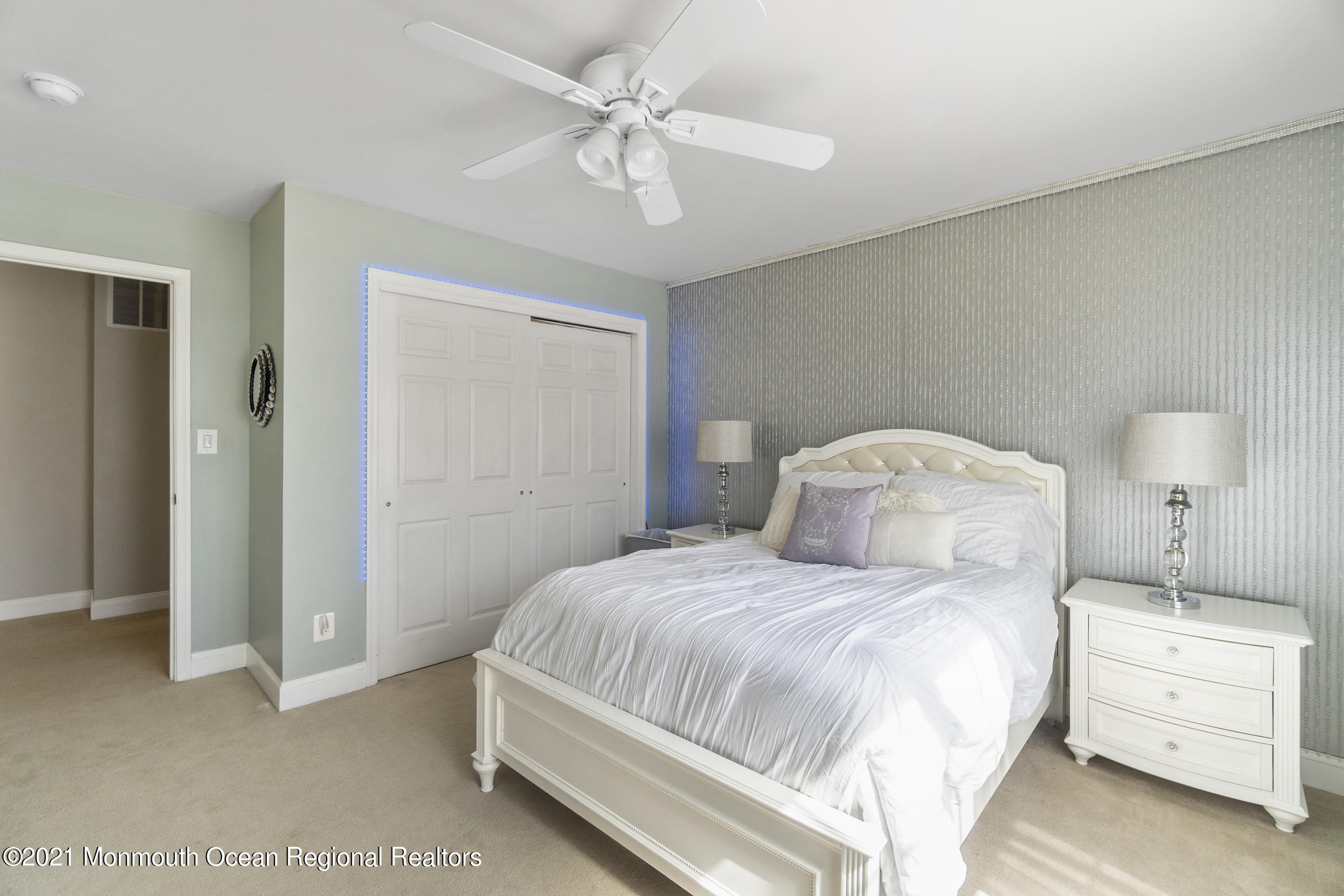 9 Rutgers Drive Howell, NJ 07731 - Photo 23 of 45 a bedroom with a bed and a chandelier