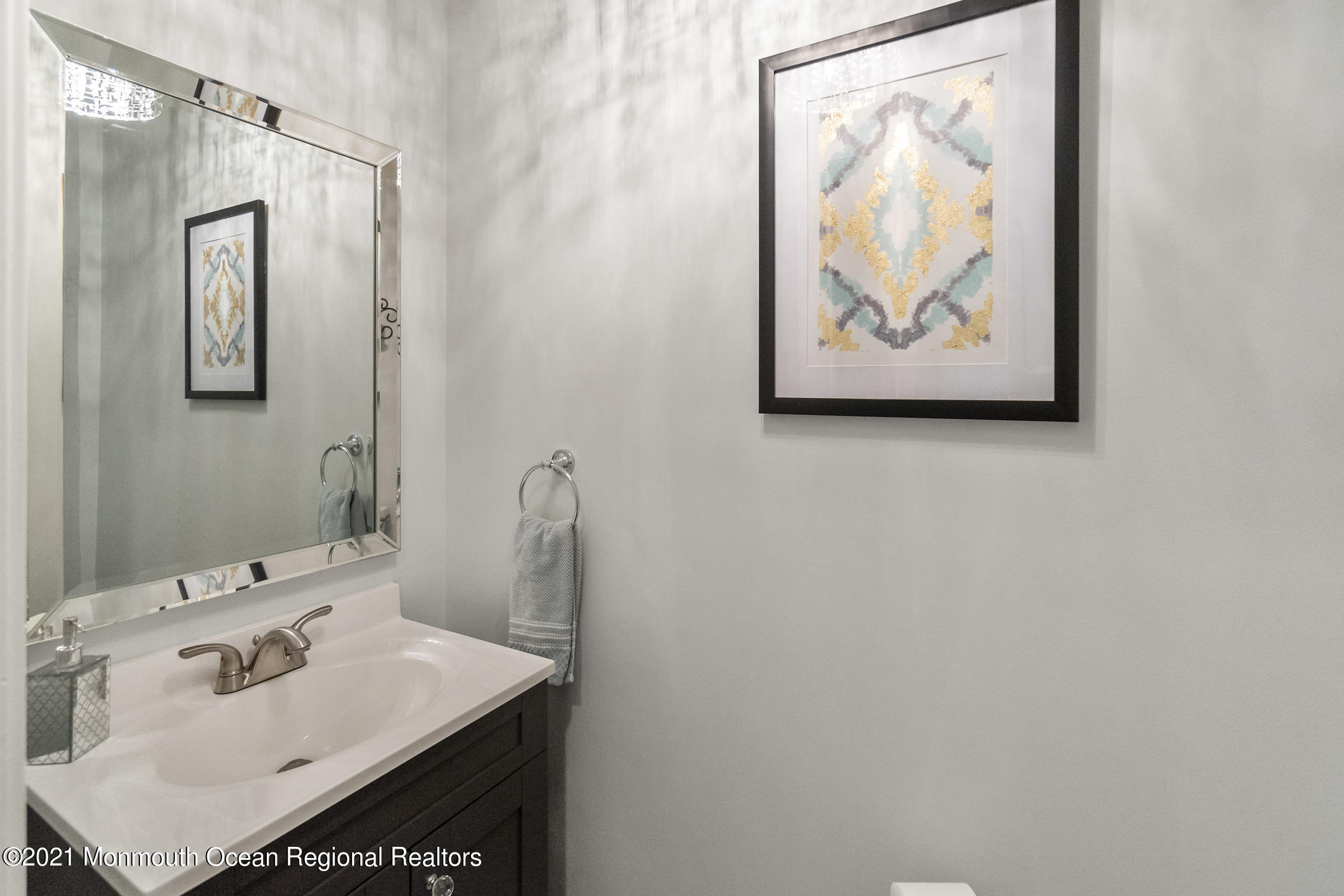 9 Rutgers Drive Howell, NJ 07731 - Photo 29 of 45 a bathroom with a sink and a mirror