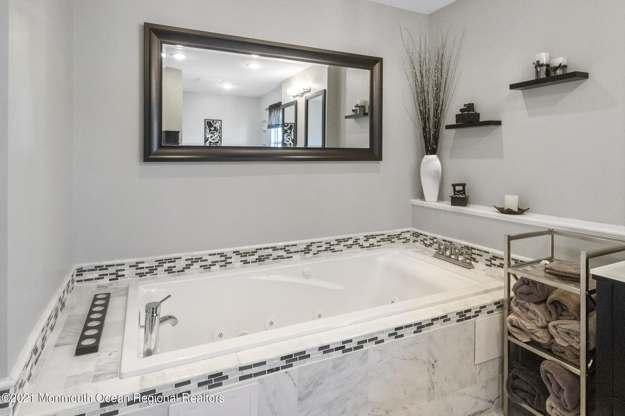 9 Rutgers Drive Howell, NJ 07731 - Photo 31 of 45 a bathroom with a bathtub and a window