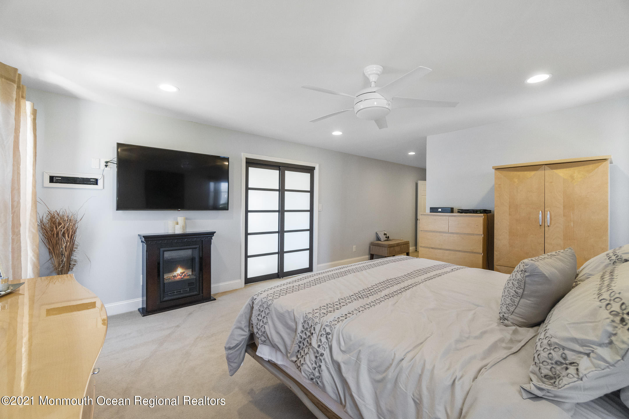 9 Rutgers Drive Howell, NJ 07731 - Photo 34 of 45 a spacious bedroom with a bed and a flat screen tv