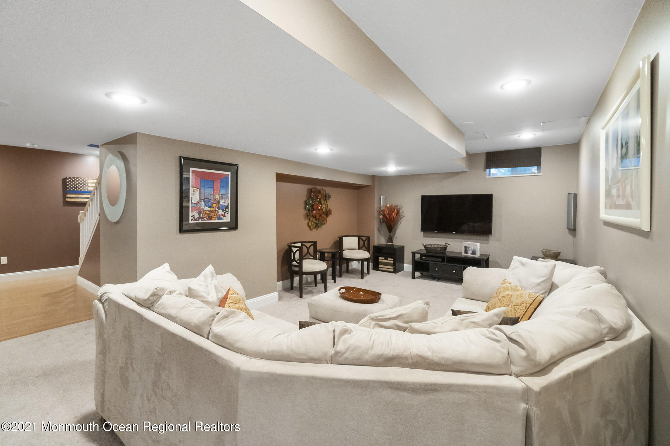 9 Rutgers Drive Howell, NJ 07731 - Photo 39 of 45 a living room with furniture and a flat screen tv