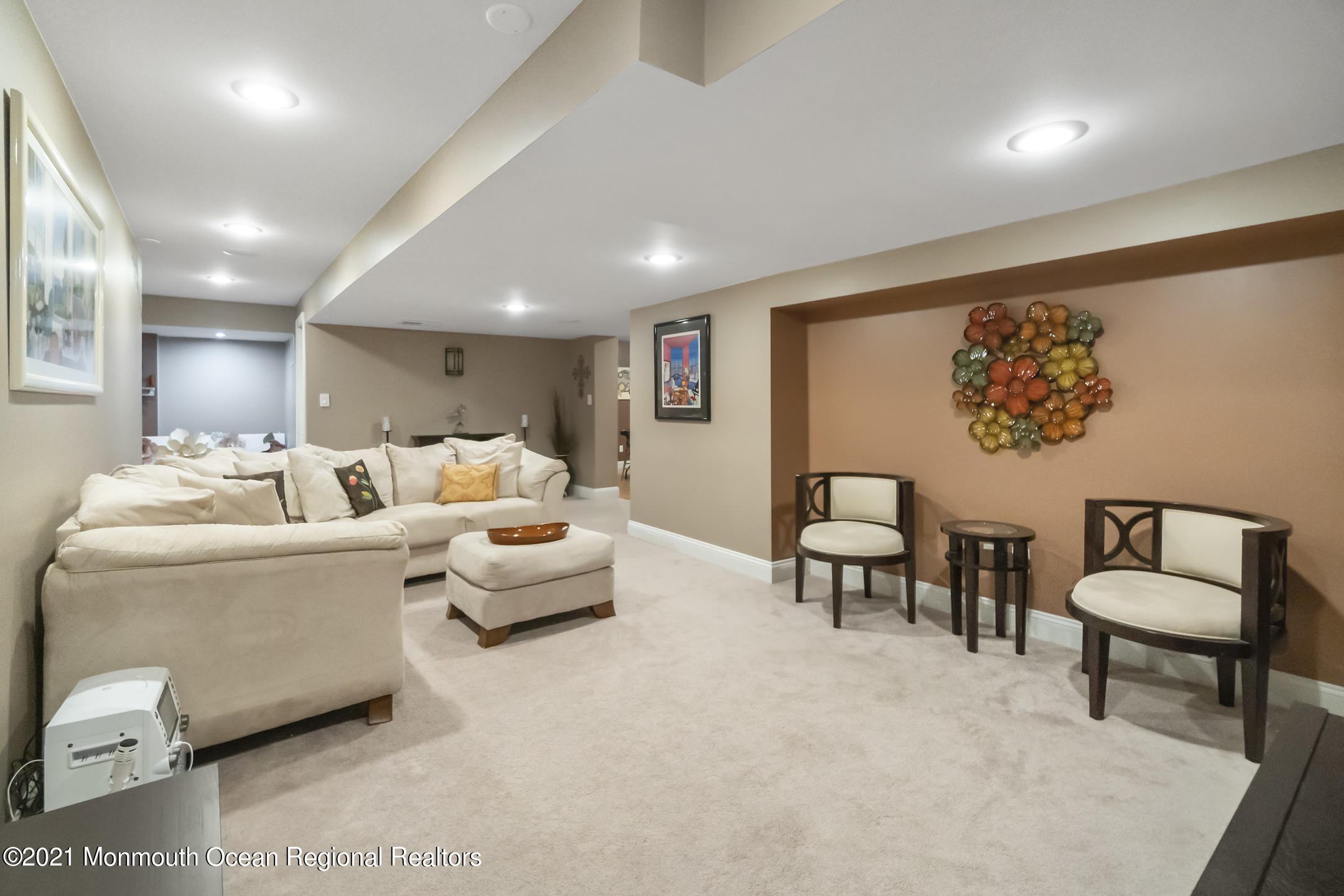 9 Rutgers Drive Howell, NJ 07731 - Photo 40 of 45 a living room with furniture and a large mirror with rug