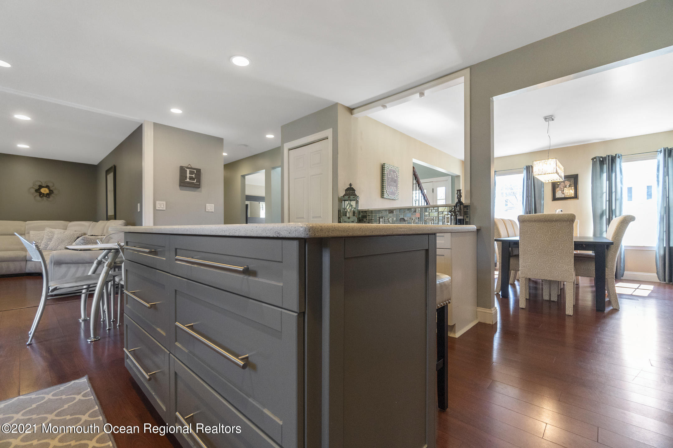 9 Rutgers Drive Howell, NJ 07731 - Photo 9 of 45 a kitchen with a table chairs wooden floors and a view of living room