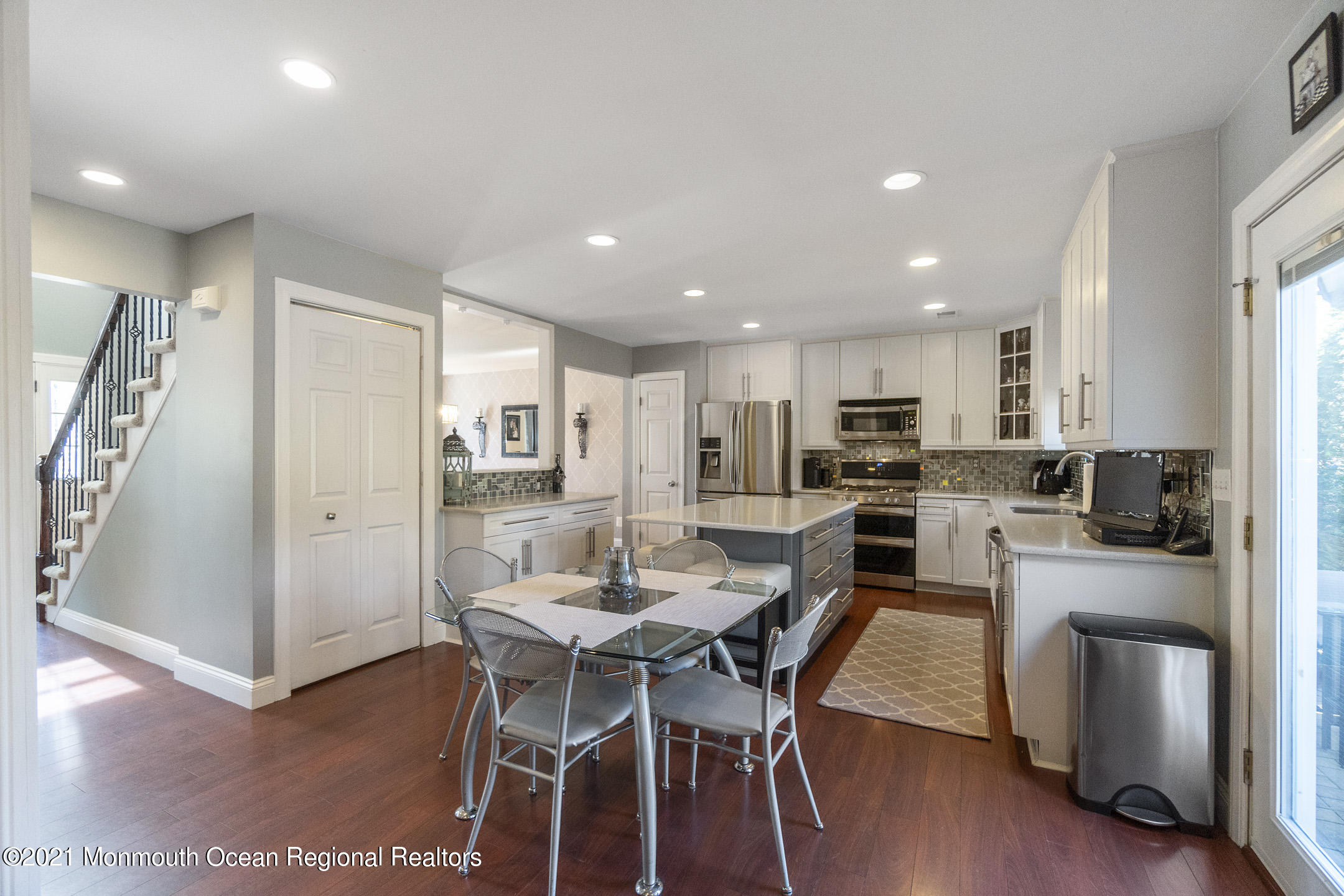 9 Rutgers Drive Howell, NJ 07731 - Photo 10 of 45 a kitchen with a table and chairs in it