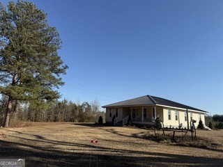 142 Wilson Way Musella, GA 31066 - Photo 2 of 39 a front view of a house with a yard