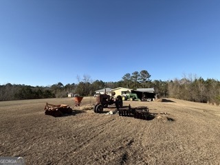 142 Wilson Way Musella, GA 31066 - Photo 27 of 39 a view of a lake with a car parked