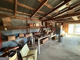 142 Wilson Way Musella, GA 31066 - Photo 29 of 39 a view of a storage room with racks