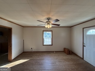142 Wilson Way Musella, GA 31066 - Photo 32 of 39 an empty room with a window and a ceiling fan