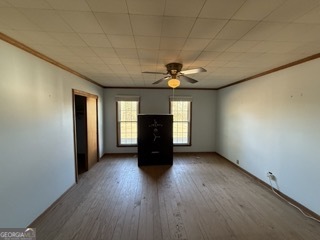 142 Wilson Way Musella, GA 31066 - Photo 36 of 39 a view of a livingroom with wooden floor and a ceiling fan