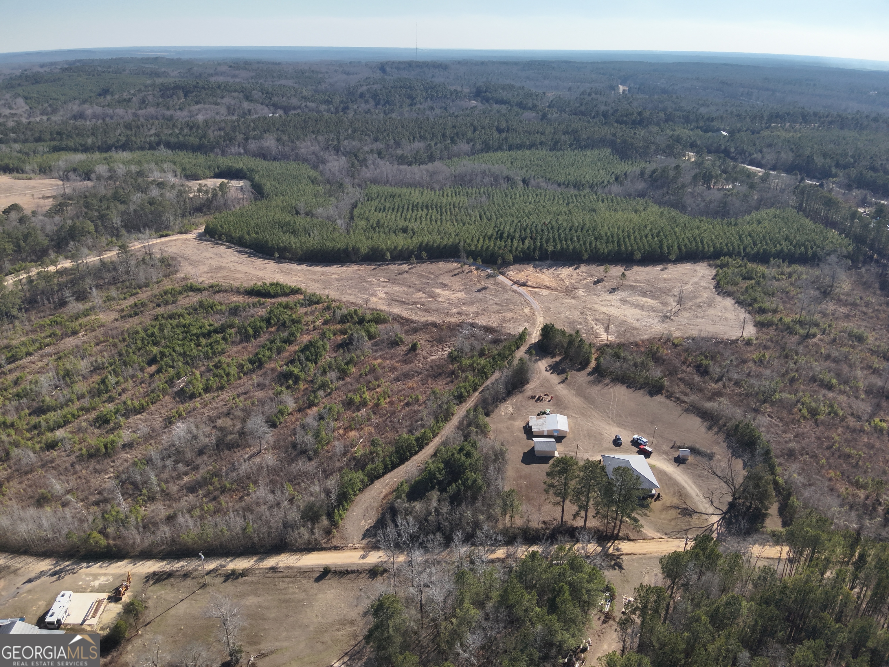 142 Wilson Way Musella, GA 31066 - Photo 4 of 39 a view of a dry yard with green space