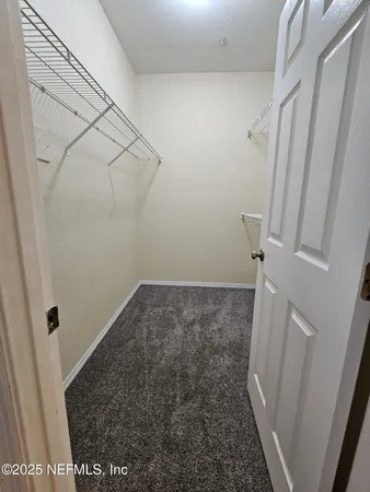 a view of a room with racks on the wall