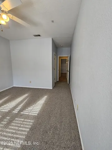 a view of a room with an empty space