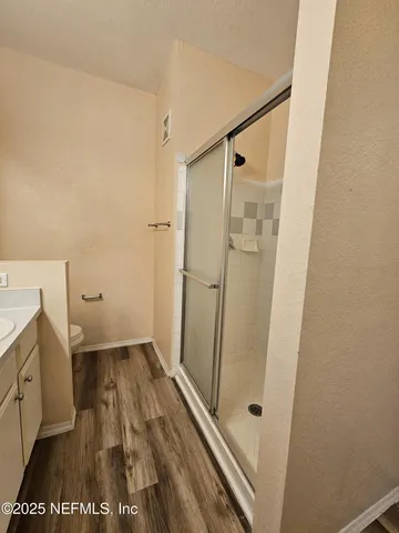 a bathroom with a sink and a shower