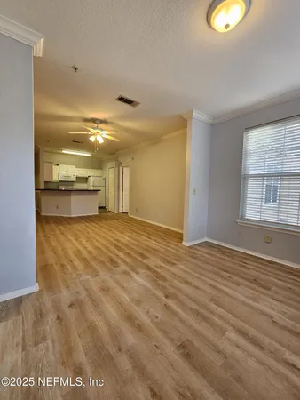 a view of an empty room with a window