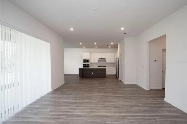a kitchen with stainless steel appliances a refrigerator stove and sink