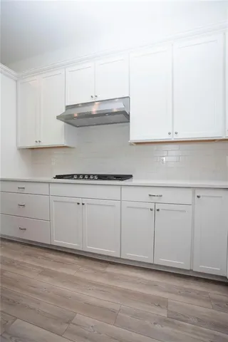 a view of staircase with wooden floor and staircase