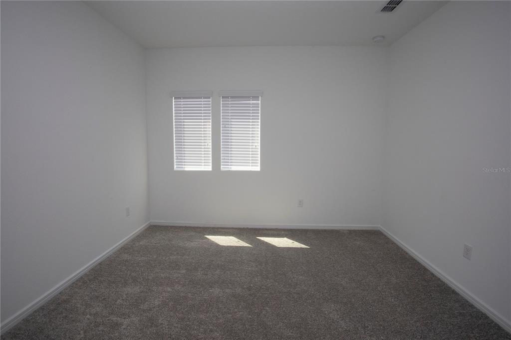 14184 Hammock Crest Way Riverview, FL 33569 - Photo 57 of 59 an empty room with a window
