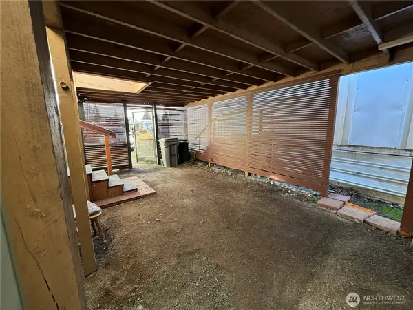 a view of a room with wooden walls