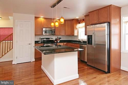 6304 Ford Road Frederick, MD 21702 - Photo 3 of 29 a kitchen with stainless steel appliances granite countertop a refrigerator a sink and a stove