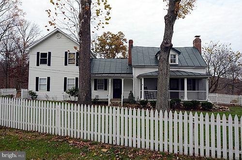 6304 Ford Road Frederick, MD 21702 - Photo 22 of 29 a front view of a house with a garden