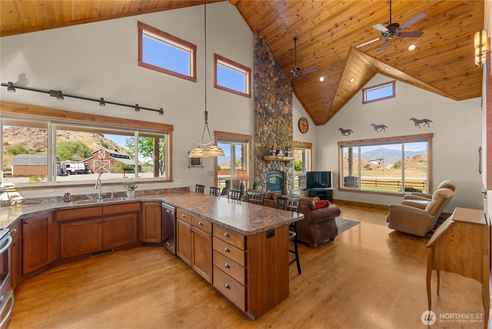 23 George Road Omak, WA 98841 - Photo 14 of 40 a large kitchen with stainless steel appliances granite countertop a lot of counter space and windows