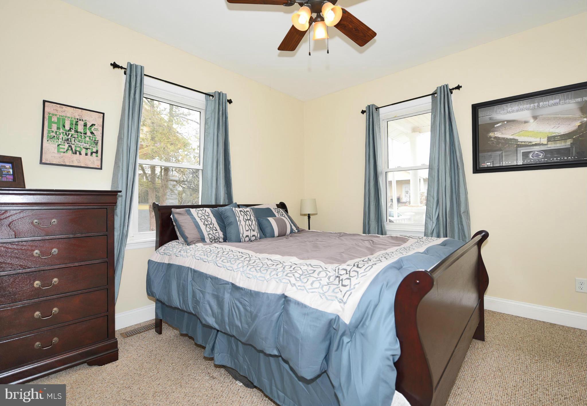 710 Elmwood Road Baltimore, MD 21206 - Photo 13 of 30 a bedroom with a bed and painting on the wall
