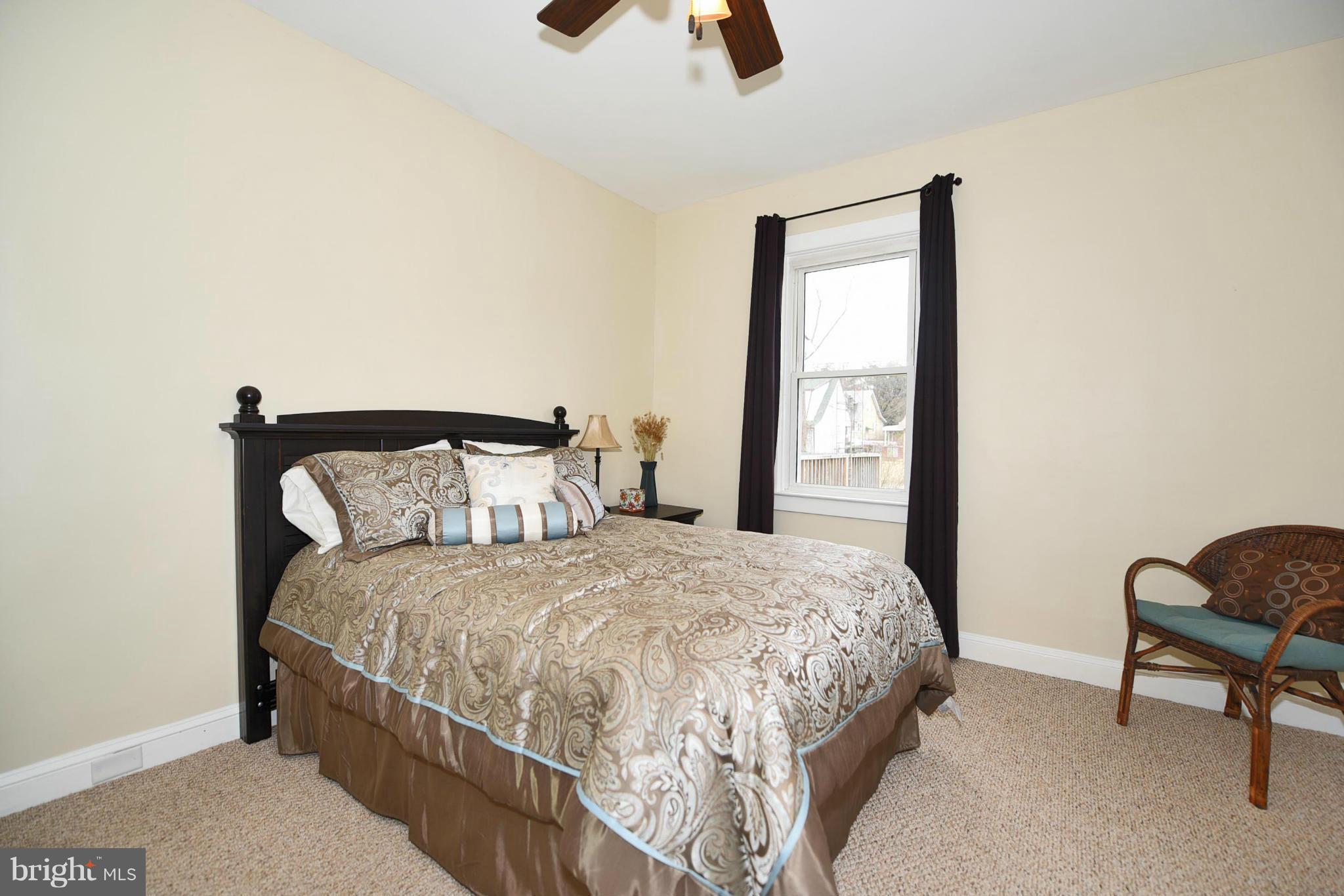 710 Elmwood Road Baltimore, MD 21206 - Photo 14 of 30 a bedroom with a bed and window
