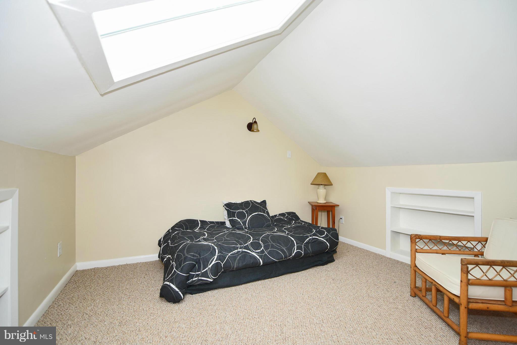 710 Elmwood Road Baltimore, MD 21206 - Photo 15 of 30 a bedroom with a bed and a window
