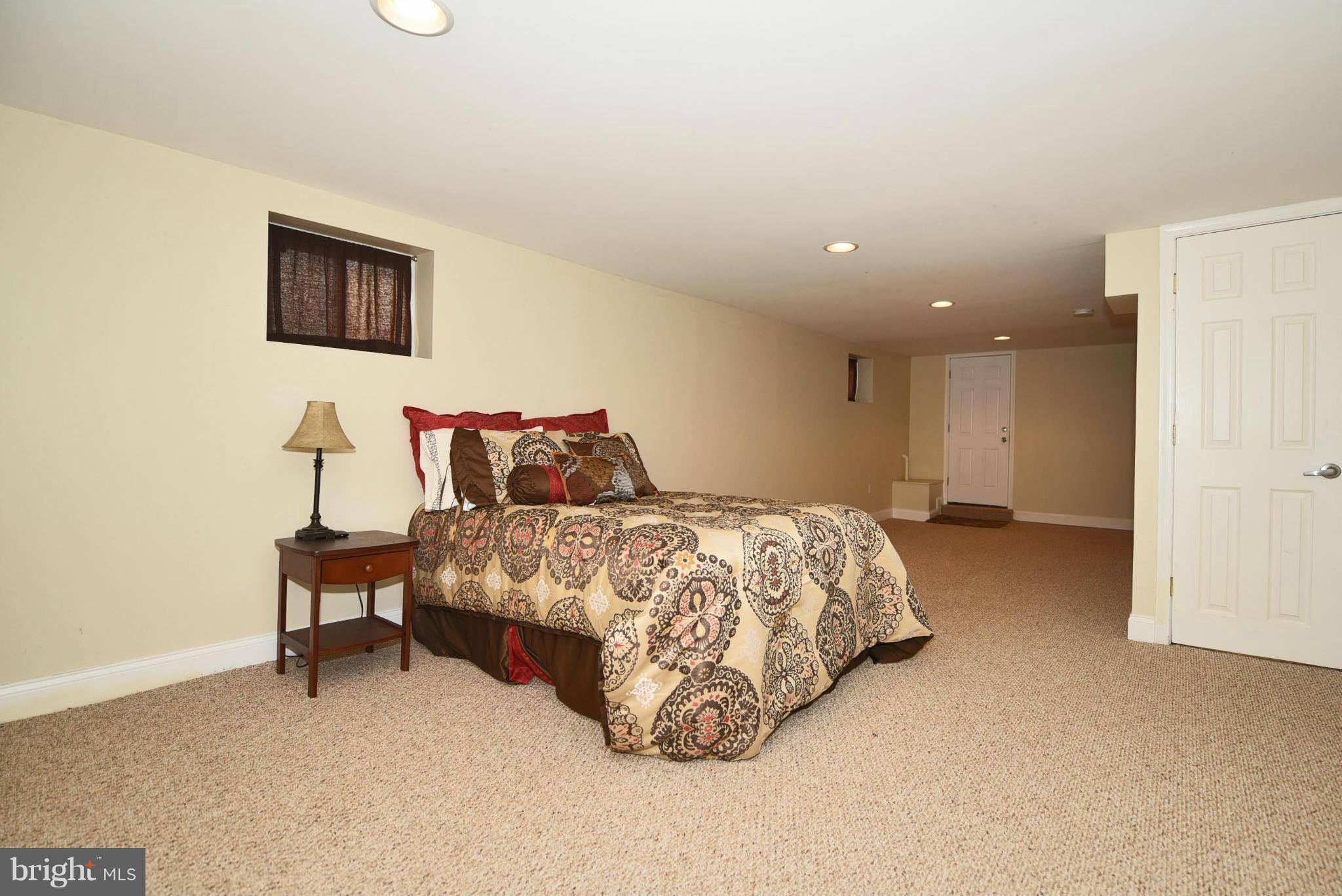 710 Elmwood Road Baltimore, MD 21206 - Photo 20 of 30 a bedroom with a bed and a painting