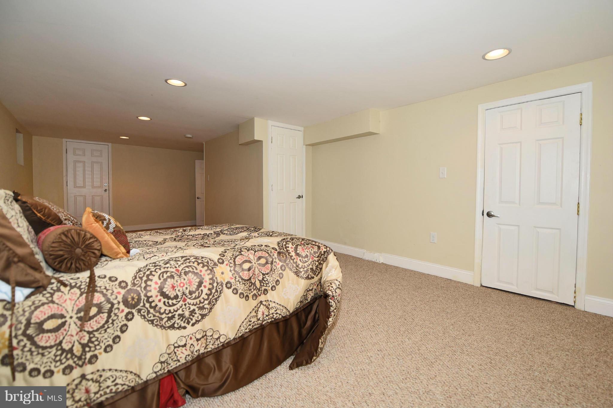 710 Elmwood Road Baltimore, MD 21206 - Photo 21 of 30 a bedroom with a bed and a window