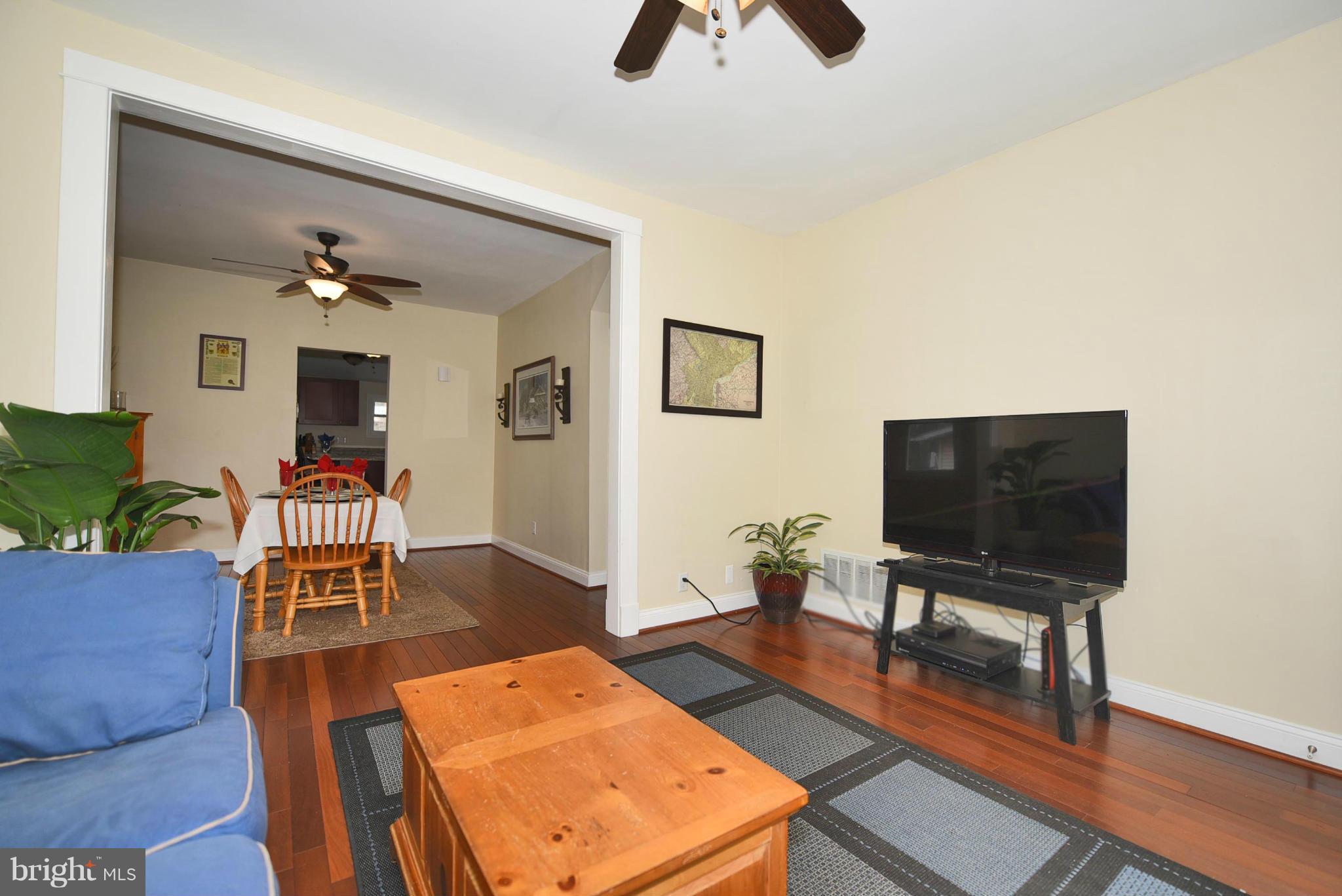 710 Elmwood Road Baltimore, MD 21206 - Photo 4 of 30 a living room with furniture and a flat screen tv