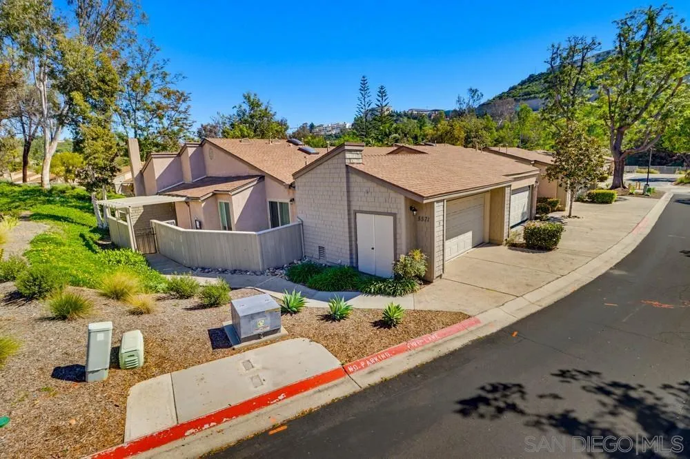 5571 Adobe Falls Road, Unit D San Diego, CA 92120 - Photo 2 of 60 a front view of house with yard and green space
