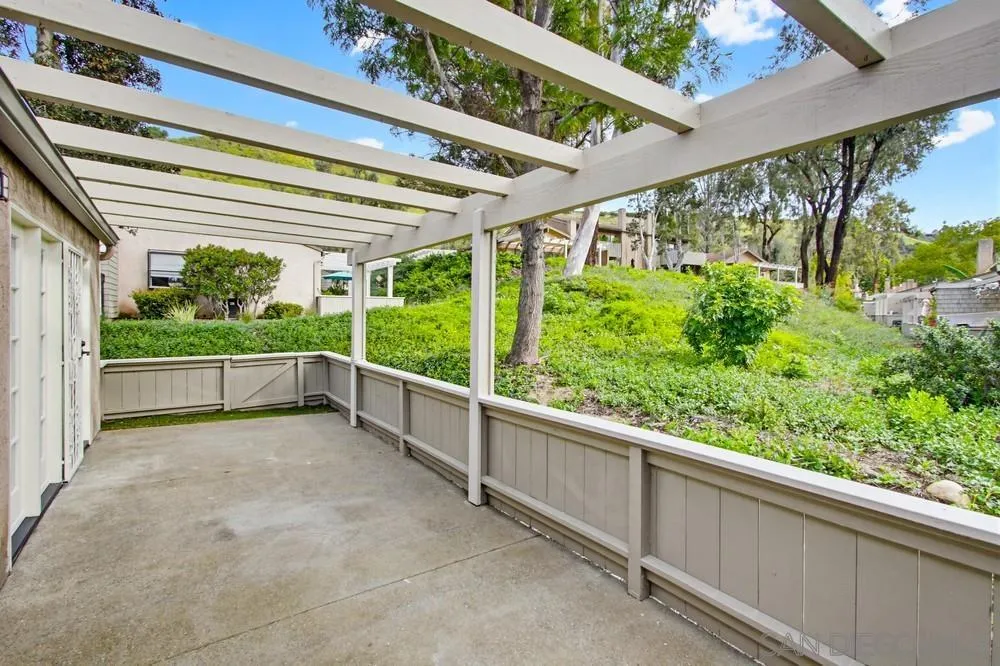 5571 Adobe Falls Road, Unit D San Diego, CA 92120 - Photo 9 of 60 a view of a porch and garden