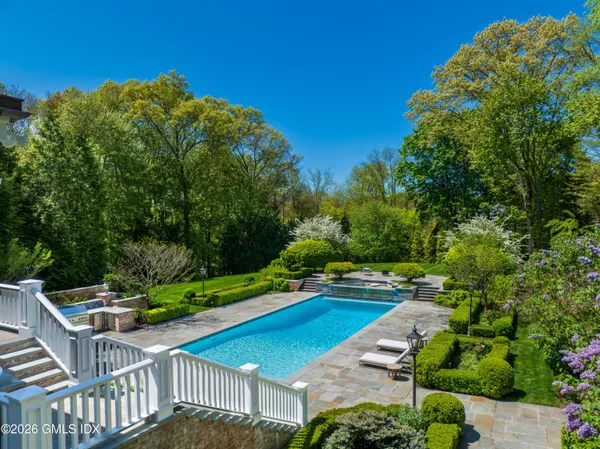 a view of an outdoor space with deck and yard