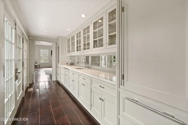 a spacious bathroom with a double vanity sink and a mirror