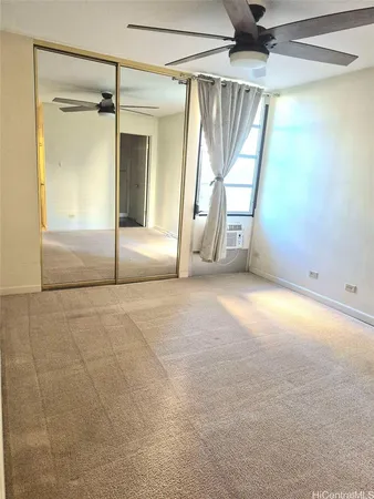 a view of an empty room with a fireplace