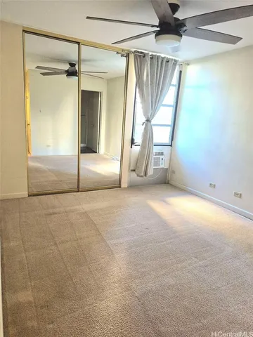 a view of an empty room with a fireplace