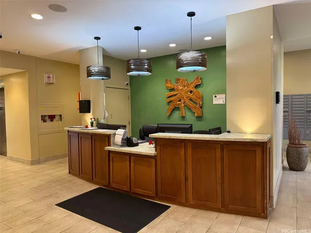 a view of kitchen with stainless steel appliances granite countertop a sink and a refrigerator