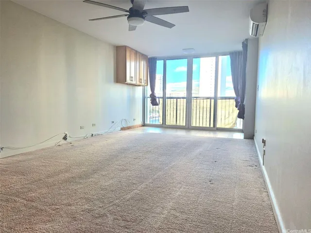 a view of an empty room with a window