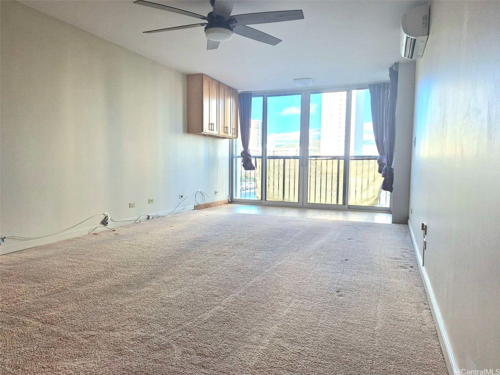 3161 Ala Ilima Street, Unit 202 Honolulu, HI 96818 - Photo 3 of 18 a view of an empty room with a window