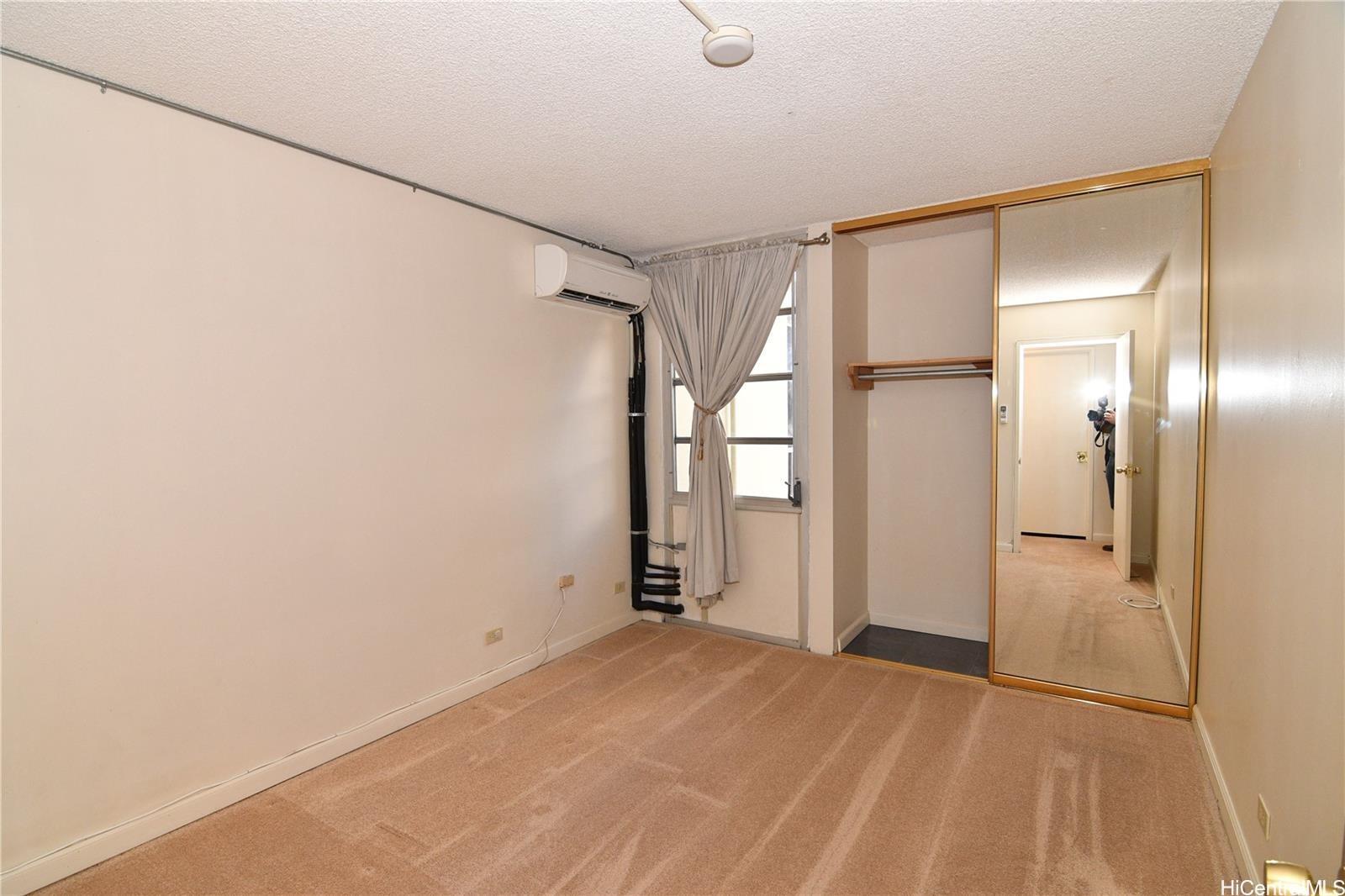 3161 Ala Ilima Street, Unit 202 Honolulu, HI 96818 - Photo 7 of 18 a view of empty room with wooden floor