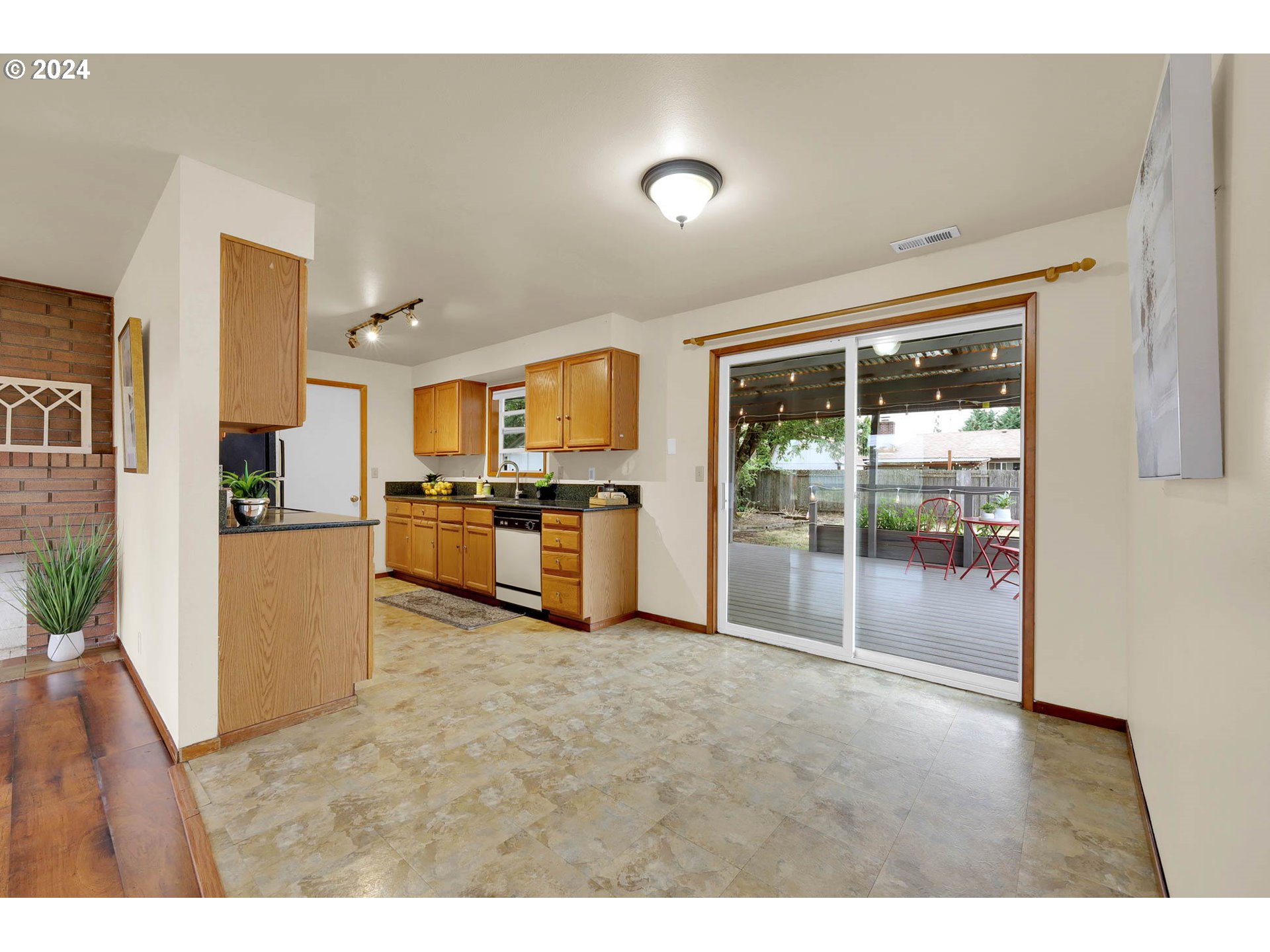 1452 N Street Springfield, OR 97477 - Photo 7 of 30 a open kitchen with cabinets and a stainless steel appliances